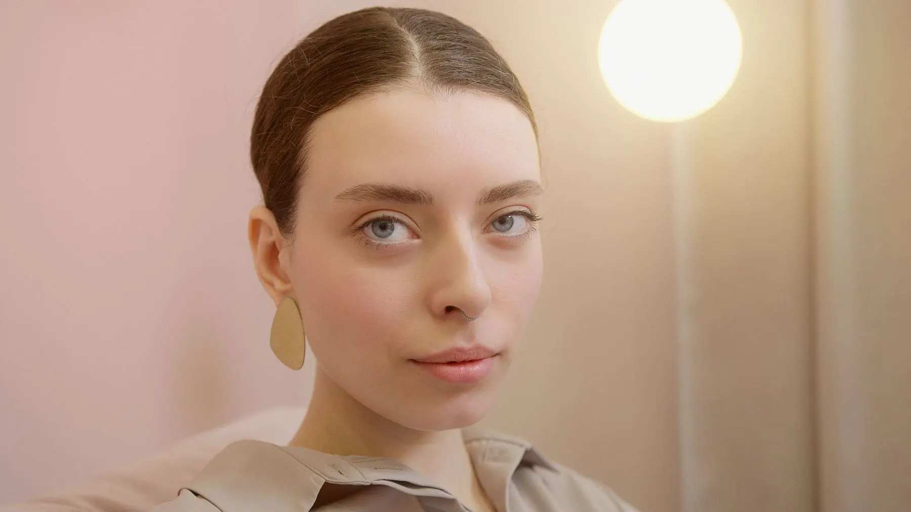 Portrait of a young woman in soft, warm light