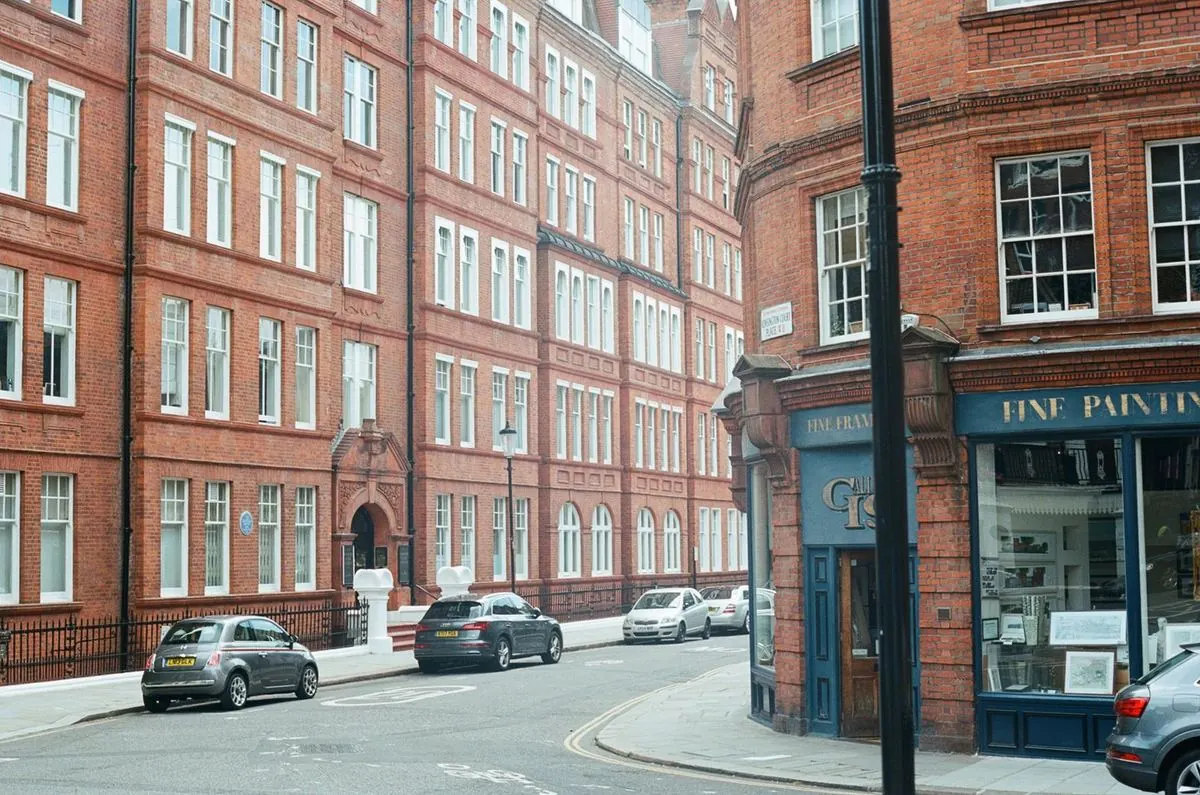 Red-brick mansion blocks on a quiet street in north-west central London