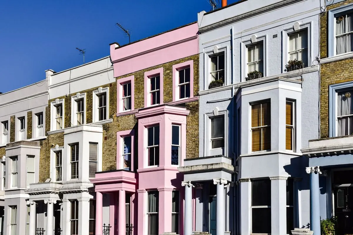 Pastel-painted Victorian terraced houses in Notting Hill