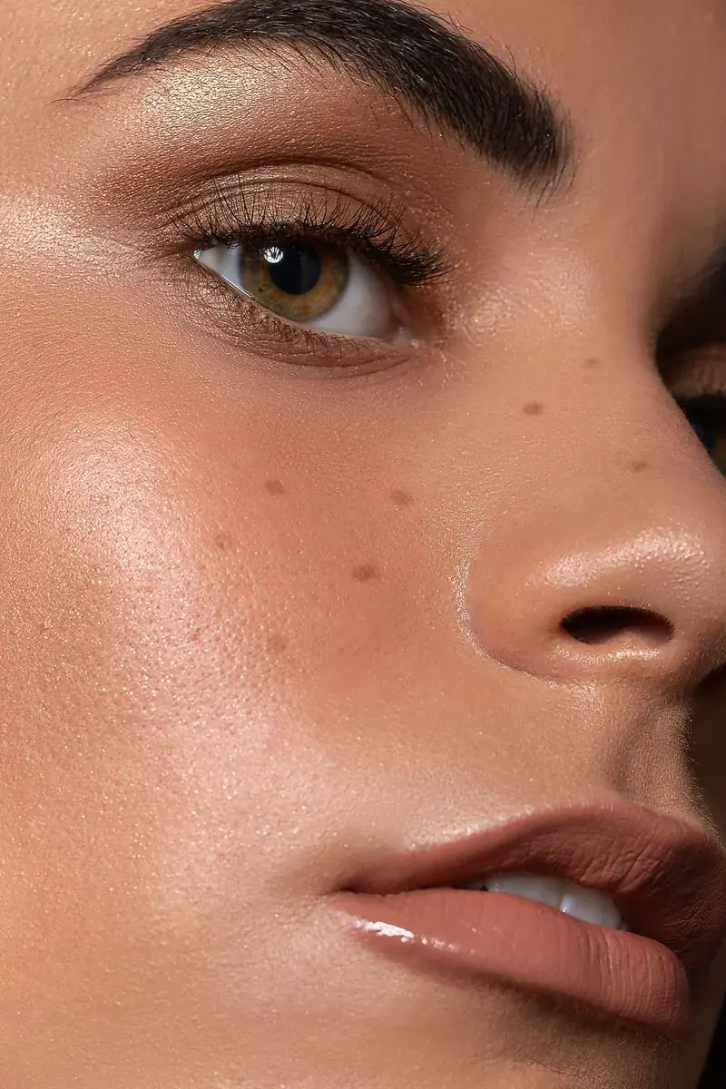 Client relaxing with glowing skin during a skin treatment